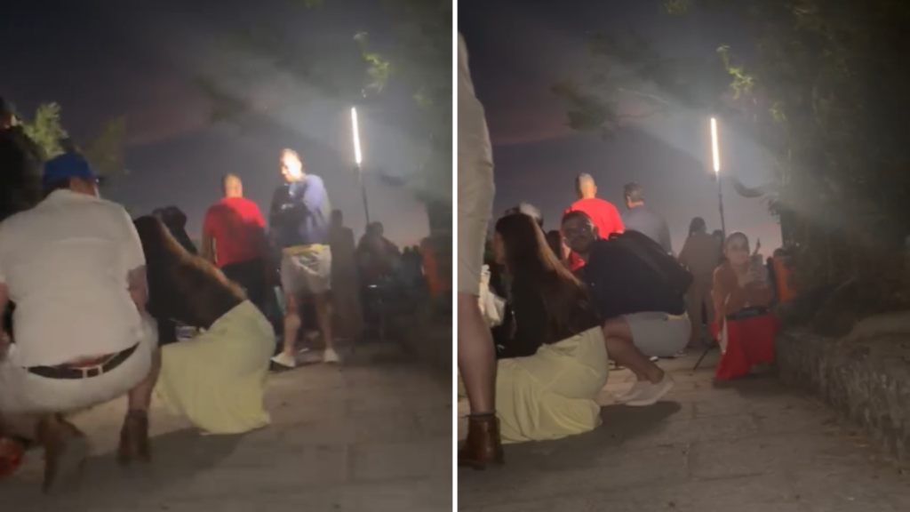 Turistas se protegem durante tiroteio no Mirante Dona Marta, no Rio